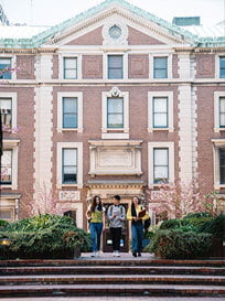 Students of different nationalities walking out of a building