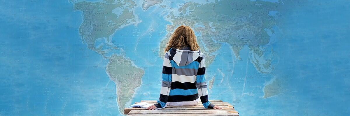 Girl looking at the world map